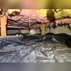 Before encapsulation, drooping fiberglass from the subfloor