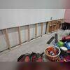 This is what the basement looked like once the bottom portion of the wall had been removed and the floor was cleared off. This step needed to be done so our team could do the work properly.
