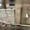 Before the project began, settlement had caused the retaining wall and adjacent brickwork to separate, creating visible gaps and signs of structural movement. These conditions indicated a loss of support beneath the wall and highlighted the need for permanent stabilization.