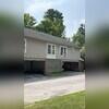 Before the shingles were removed show of damaged roofing