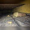 The insulation in this crawl space is rotting and weighed down by moisture.