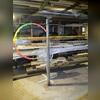 Temporary support posts had been relied upon as a permanent solution for the floor system. Over time, these supports deteriorated due to corrosion, resulting in a loss of structural capacity and contributing to significant floor sagging.
