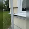 Identifying severe moisture intrusion and rot damage along the exterior window sill and trim.