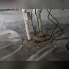 A TripleSafe Sump Pump System (shown here), combined with a SaniDry dehumidifier, represents the ultimate in crawl space waterproofing and humidity control.