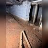 Moisture damage is visible on the concrete block walls in the crawl space. You can see the water line where water is actually seeping out.