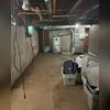 In other parts of Jean's basement, more signs of water intrusion were hiding in plain sight. White, chalky residue running down the walls, damp blocks along the base of the foundation, and a dark line running down where the wall meets the floor. All clear signs of water issues at play!