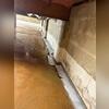 In-progress view: WaterGuard in the trench, poised to divert water away from foundation walls.