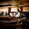 Installing the new wood beam, replacing the old and crumbling beam.