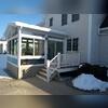 A 4' x 7' Trex landing and stairs into their four season sunroom