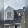 Once the protective work around the dormers was complete, the existing siding was carefully reinstalled. Returning the original exterior materials to place creates a clean finished appearance while concealing the important flashing components working underneath.