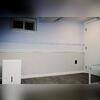 The basement walls were restored with gray EverLast wall restoration. EverLast wall systems are designed specifically for below-grade spaces, providing a durable alternative to traditional drywall in a finished basement.