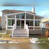 The view of the front wall shows just how big their Sunroom is.