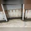 Concrete is laid over the drainage system to restore the floor's flat surface. The drywall can be replaced, minimizing the appearance of the repair.