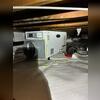 An AprilAire dehumidifier sits above the newly installed white vapor barrier beneath this Los Alamitos home. A condensate pump and connected tubing are visible beside the unit as part of the crawlspace moisture control installation.