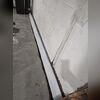 The system is visible here before covering, ready to capture water and direct it to the sump pump.