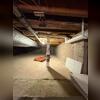 Radon piping installed in the crawl space to help draw radon from beneath this section of the foundation.