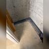 The drainage system is installed into the floor and eventually has new concrete placed over it, allowing for an unobtrusive system.