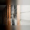 The walls were sanded at the areas the straps would be adhered to the wall.