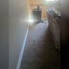 Our crew came up with a plan to move the leaks from the corner to the sump pump with our sub-floor drainage system that would cut through this area into the next room where the sump pump was.