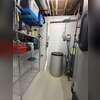 The existing radon piping runs through the basement near the mechanical equipment and boiler area.
