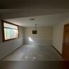 In this finished space the sub-floor drainage system prevents future water damage from occurring in the finished space.
