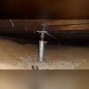 The original support installed in the crawlspace of the home have not been able to keep up with the home's settling.