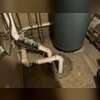 The basement sump area and nearby plumbing are shown, providing context for the foundation layout and the space where radon mitigation piping is installed.
