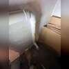 The first extraction point enters through the basement floor, connecting the mitigation piping to the area beneath the foundation to help draw radon soil gas into the system.