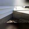 The gap between the steps and wall show that the wall has tilted away, an indication of a bowed wall.