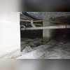 This picture illustrates what the crawl space looked like before the wall liner was installed. Which look do you like better? DryZone can clean up the messy debris filled crawl space!