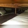 Drainage matting was installed under the CleanSpace vapor barrier. The drainage matting prevents water from pooling underneath the vapor barrier.