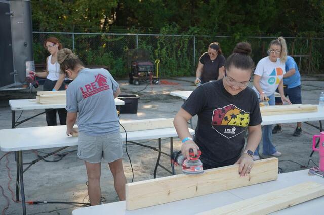 LRE team constructing bed frames. 