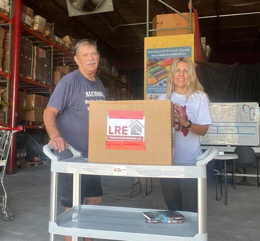 LRE donates school supplies.